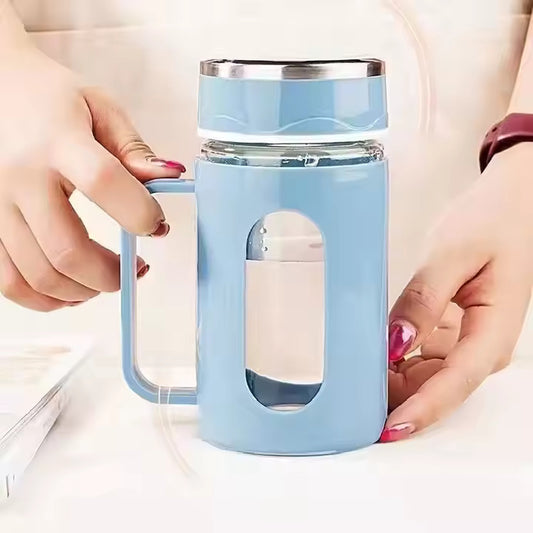 Double-walled glass tea cups with handles.