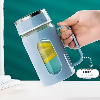 Double-walled glass tea cups with handles.