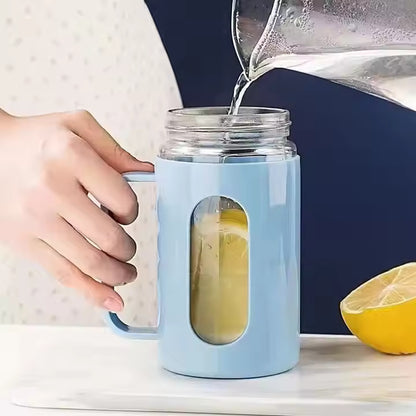 Double-walled glass tea cups with handles.