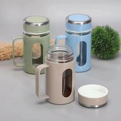 Double-walled glass tea cups with handles.